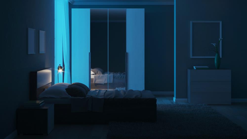 Modern interior of a bedroom with light green walls