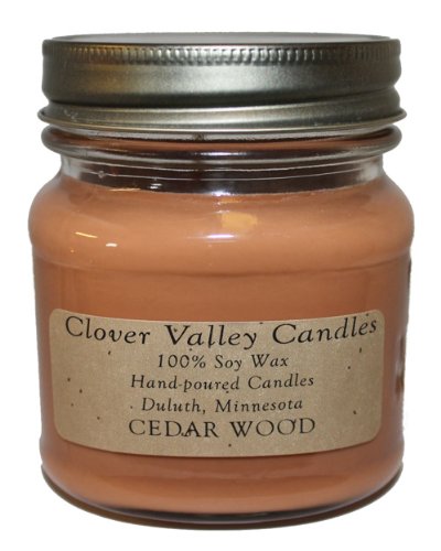 a jar of cedarwood scented candle made of 100% soy wax