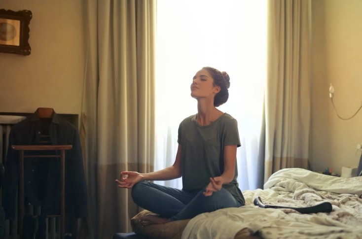 woman meditating at home